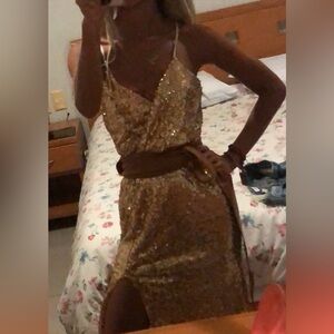 Gold sequined long dress with side slit